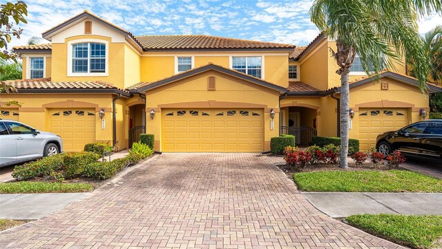 mediterranean / spanish-style house featuring a garage