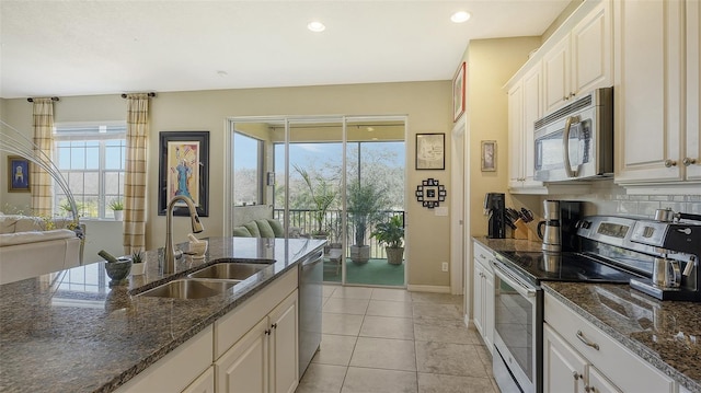 kitchen featuring white cabinetry, sink, and appliances with stainless steel finishes