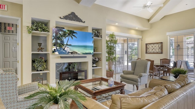 living room with lofted ceiling with beams, ceiling fan, and built in shelves