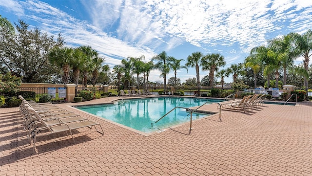 view of swimming pool with a patio area