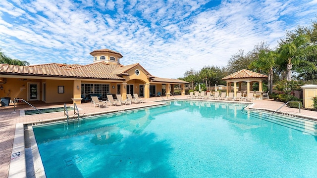 view of pool with a gazebo and a patio area