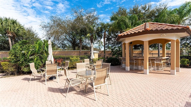 view of patio featuring a gazebo and an outdoor bar