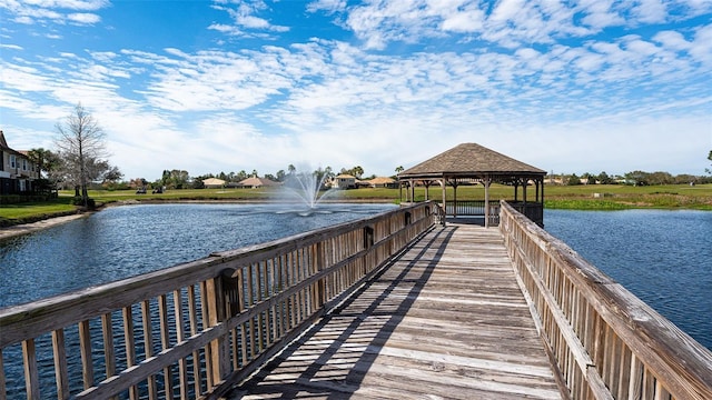 dock area featuring a gazebo and a water view