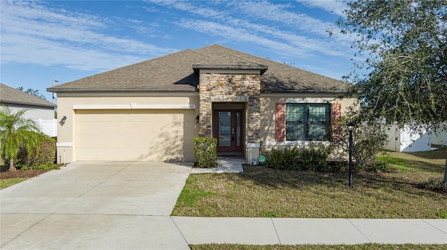 view of front of home featuring a garage and a front yard