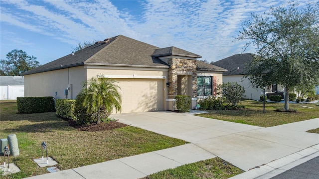 view of front of house with a garage and a front yard