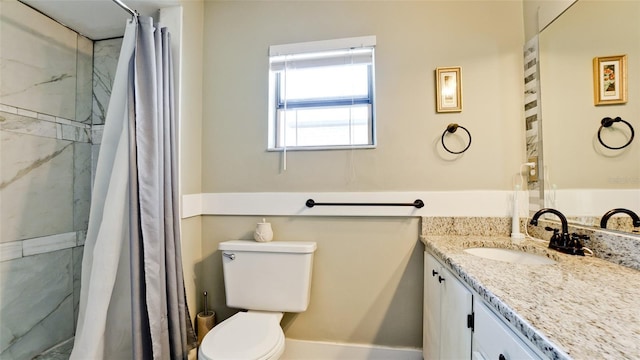 bathroom with vanity, toilet, and a shower with shower curtain