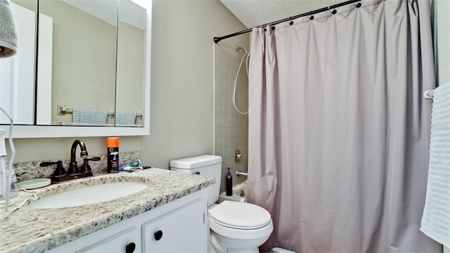 full bathroom with vanity, shower / tub combo with curtain, a textured ceiling, and toilet