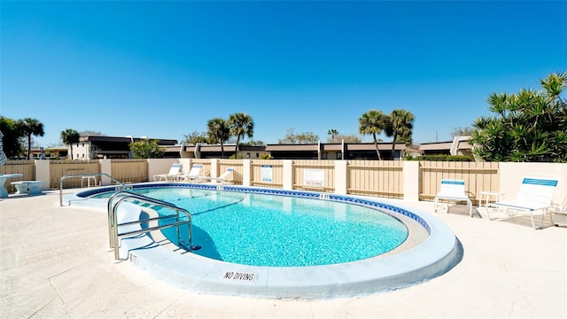 view of swimming pool with a patio area