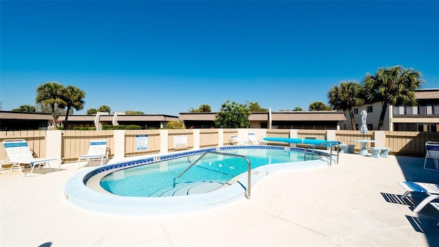 view of swimming pool featuring a patio area