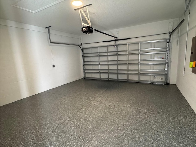 garage featuring a garage door opener and electric panel