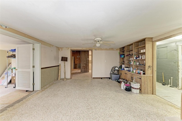 basement with ceiling fan