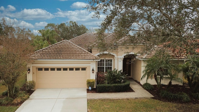 mediterranean / spanish-style house featuring a garage