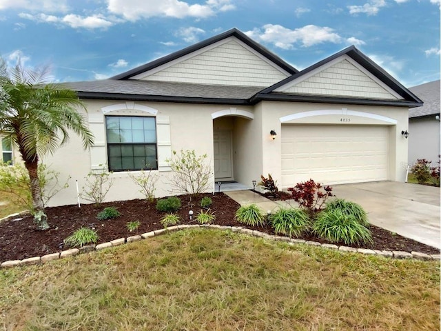 view of front facade featuring a garage and a front yard