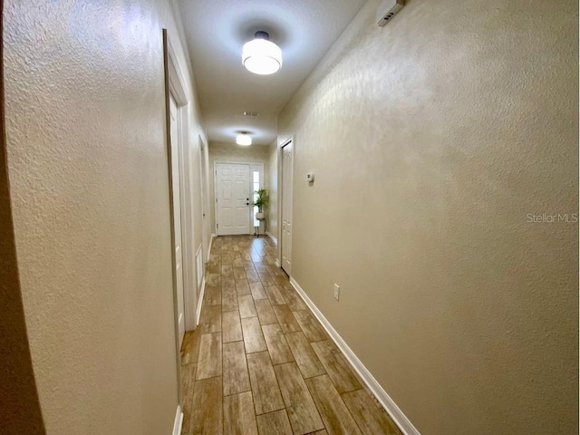 hall with light hardwood / wood-style floors