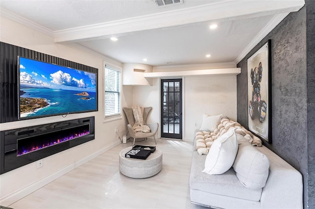 home theater room featuring hardwood / wood-style flooring and ornamental molding