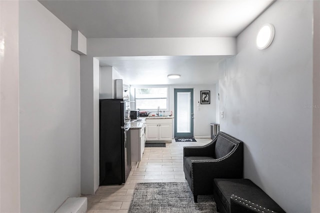 hall with light tile patterned floors