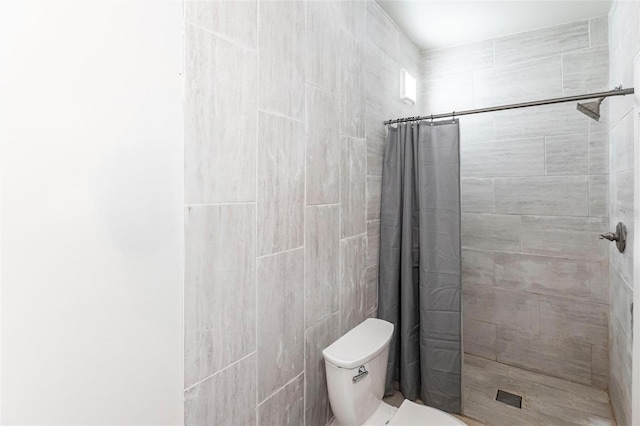 bathroom with toilet and walk in shower