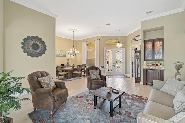 living room featuring an inviting chandelier, ornamental molding, french doors, and light tile patterned flooring