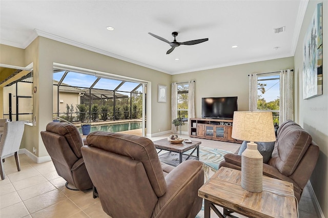 living room featuring crown molding, light tile patterned floors, and ceiling fan