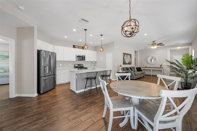 dining room with sink and ceiling fan