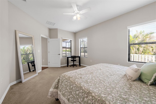 bedroom with ceiling fan and light carpet