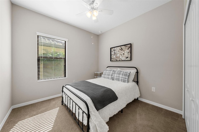 bedroom with ceiling fan and light colored carpet