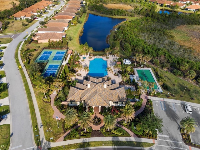 birds eye view of property with a water view