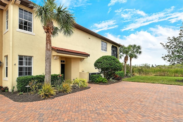 view of side of home with a patio area