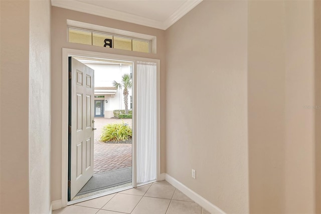 doorway to outside with crown molding and light tile patterned flooring