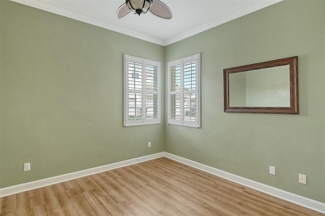 unfurnished room with crown molding and light wood-type flooring