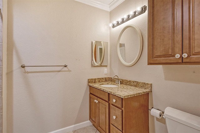 bathroom featuring crown molding, tile patterned floors, vanity, and toilet