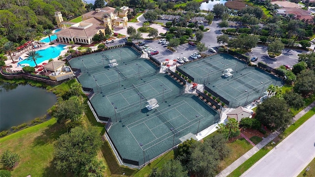 birds eye view of property with a water view