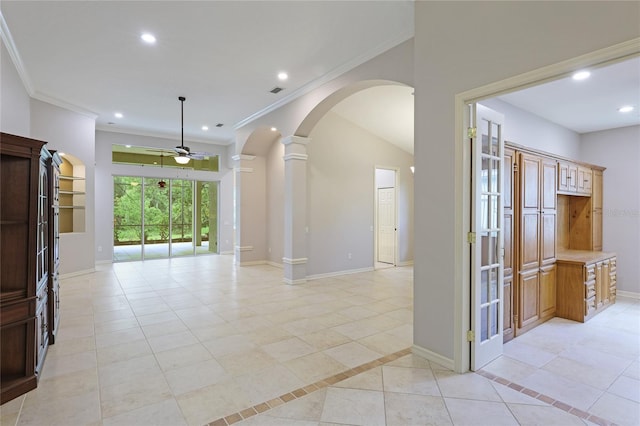 corridor featuring decorative columns, crown molding, and light tile patterned floors