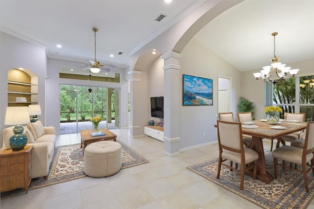 tiled dining area featuring ceiling fan with notable chandelier, crown molding, decorative columns, and a high ceiling