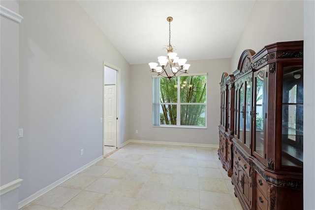 unfurnished dining area featuring lofted ceiling and an inviting chandelier