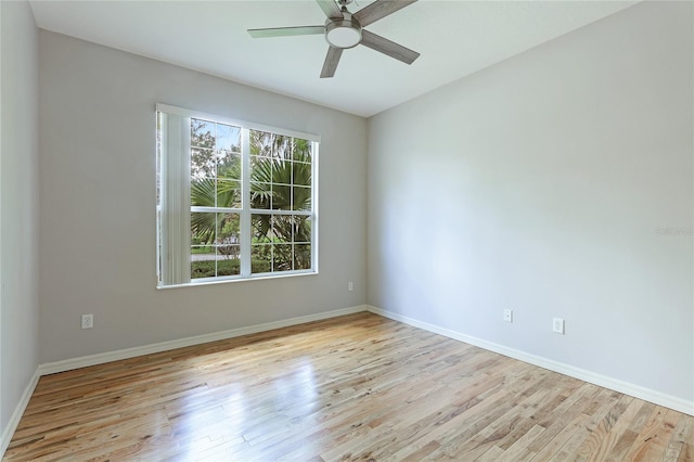 empty room featuring ceiling fan and light hardwood / wood-style flooring