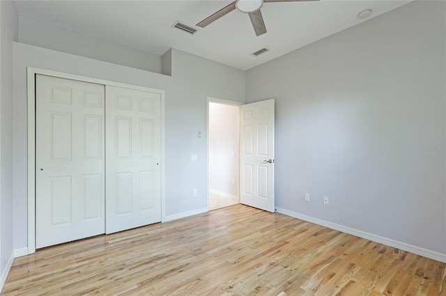 unfurnished bedroom with a closet, ceiling fan, and light wood-type flooring