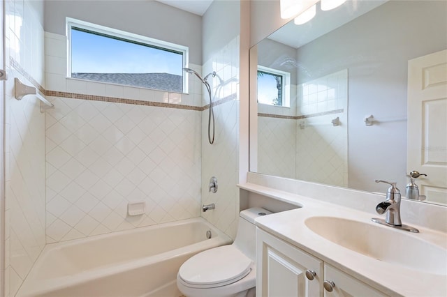 full bathroom featuring vanity, toilet, and tiled shower / bath