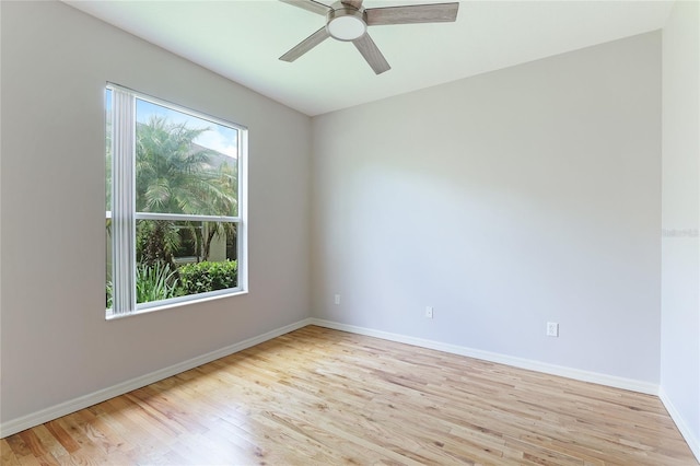 empty room featuring light hardwood / wood-style flooring and ceiling fan