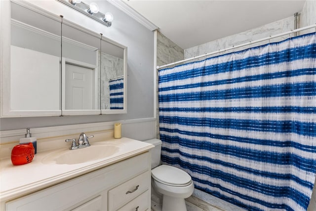 bathroom featuring vanity, toilet, ornamental molding, and a shower with shower curtain