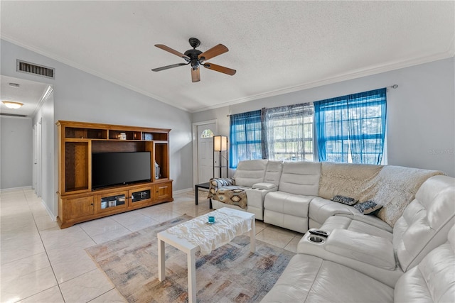 living room featuring a textured ceiling, vaulted ceiling, ornamental molding, light tile patterned flooring, and ceiling fan