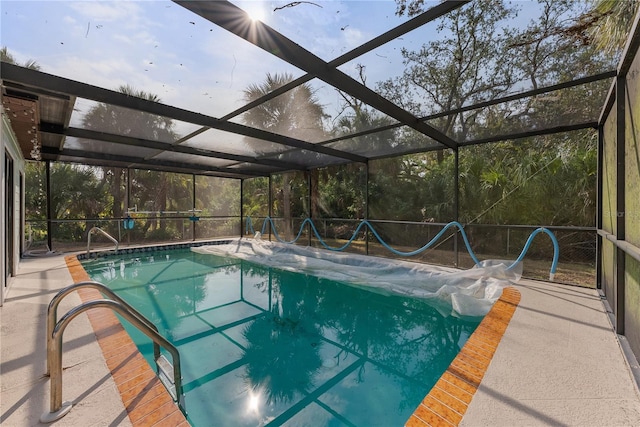 view of pool with a lanai