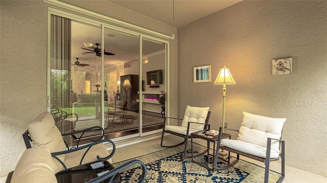 sitting room with ceiling fan