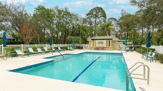 view of swimming pool with a patio area