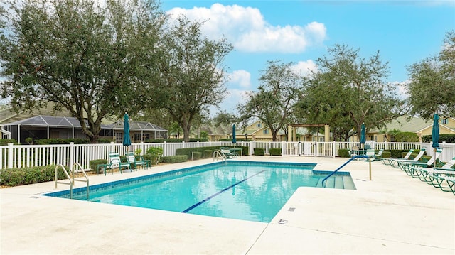 view of pool featuring a lanai and a patio area