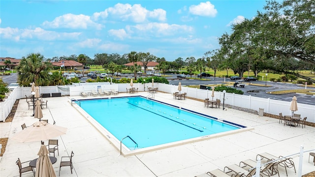 view of swimming pool with a patio area