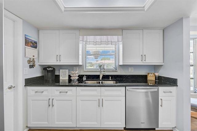 kitchen featuring white cabinetry, sink, dark stone countertops, and dishwasher