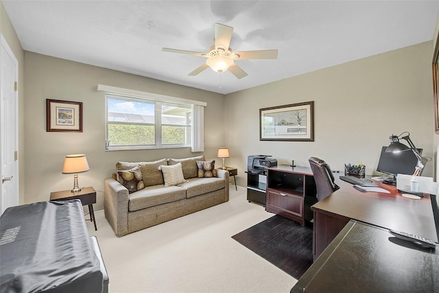 office with ceiling fan and carpet