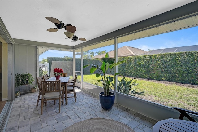 sunroom / solarium with ceiling fan