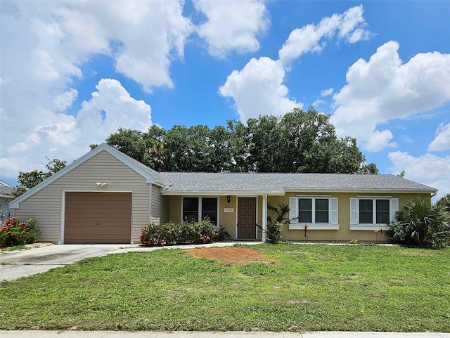 ranch-style home featuring a garage and a front yard